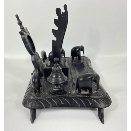 53 - An unusual ebony desk tidy complete with 5 carved elephants 25x18cm#72