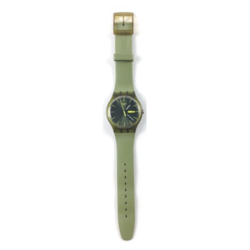 60 - A Swatch Swiss made watch with a silicone case, SR1130SW, day, date, olive face and strap, water res... 