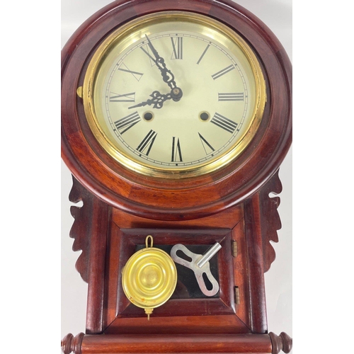 64 - A nice mahogany wall clock with a brass clock-face surround, pendulum and key - dimensions 53cm heig... 