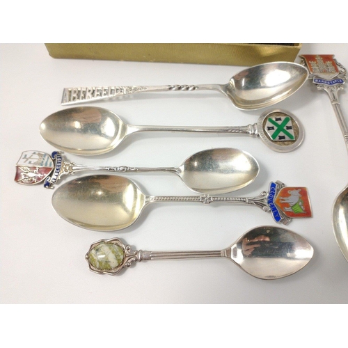 84 - Nine silver hallmarked collectors' spoons from around the UK, gross weight 110g plus a boxed sterlin... 