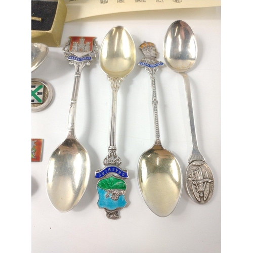 84 - Nine silver hallmarked collectors' spoons from around the UK, gross weight 110g plus a boxed sterlin... 