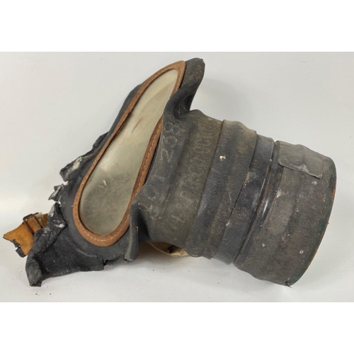 107A - Two GAS MASKS, the first, in a fragile state, is a rare civilian single eyepiece respirator stamped ... 