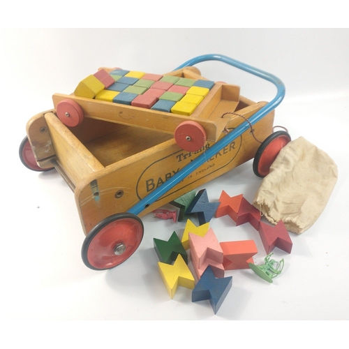 224 - A VINTAGE c1960's TRI-ANG Baby Walker 40cm x 25cm approx with a pull-along building bricks small car... 