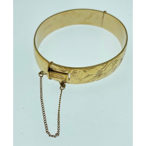 29 - LOOKS THE PART! An EXCALIBUR hand-engraved 12ct rolled gold snap-shut bracelet in original presentat... 