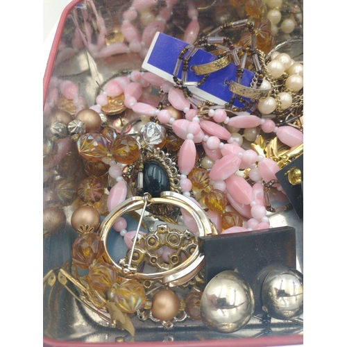 33 - A MacFarlane Lang biscuit tin loaded with costume jewellery including brooches and fashion earrings#... 