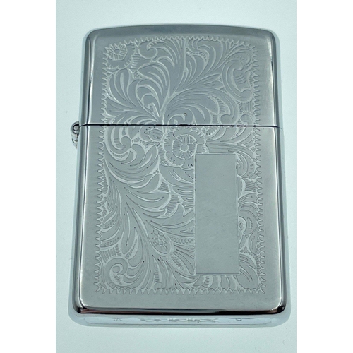 59 - Two COLLECTABLE ZIPPO LIGHTERS, one embossed with ferns and original instructions and the other with... 