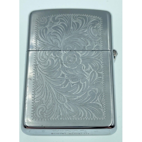 59 - Two COLLECTABLE ZIPPO LIGHTERS, one embossed with ferns and original instructions and the other with... 