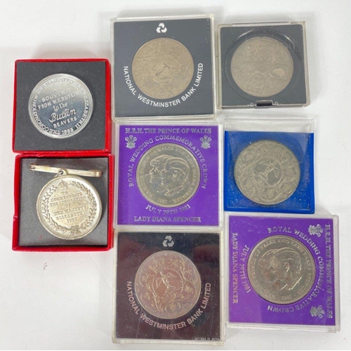 82 - A collection of medals and commemorative coins to include the Queen's 1953 Coronation medal (without... 