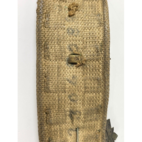 83 - Of military interest - a belt with fourteen badges and buttons including a BRITISH LIGHT INFANTRY 