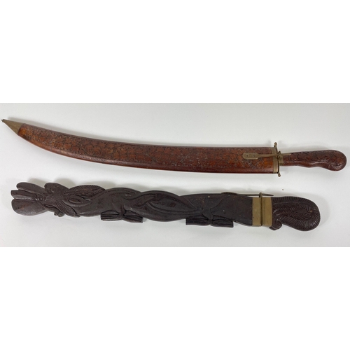 84 - Two decorative SWORDS! To include a wooden carved sheath curved sword from Thailand area 80cm long a... 