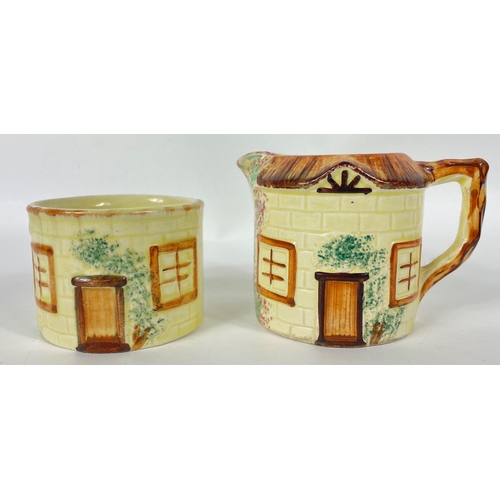 124 - A KEELE STREET pottery teapot (16cm high with milk jug and sugar bowl, a SUVESCO goblin teapot (19cm... 