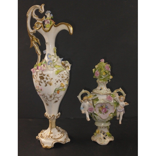 141 - A collection of highly decorated china ornaments to include a lidded jug with stopper 25cm tall (sli... 