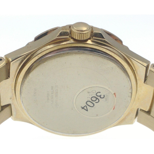 63 - A GUESS FASHION yellow metal watch within its original box with with multiple dials on the watch fac... 