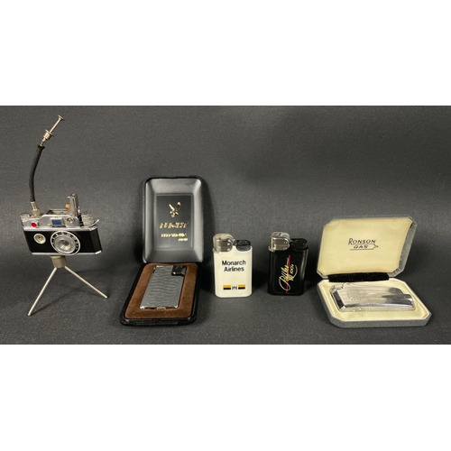 Five assorted cigarette lighters to include camera lighter, a Ronson