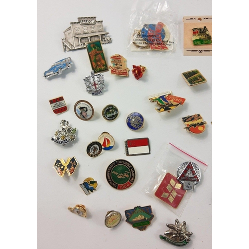 40A - A plastic tub full to include lots of collector lapel badges from all over the world#43