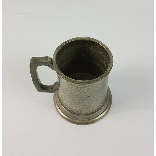 94 - A decorative PEWTER JUG, made in Sheffield. Approx Height 9.8cm, Slight nibble to the rim, overall g... 