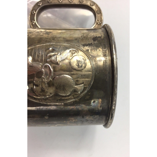 103 - A white metal Christening mug stamped 830S N 25,  possibly Russian,  attractive panels of child with... 