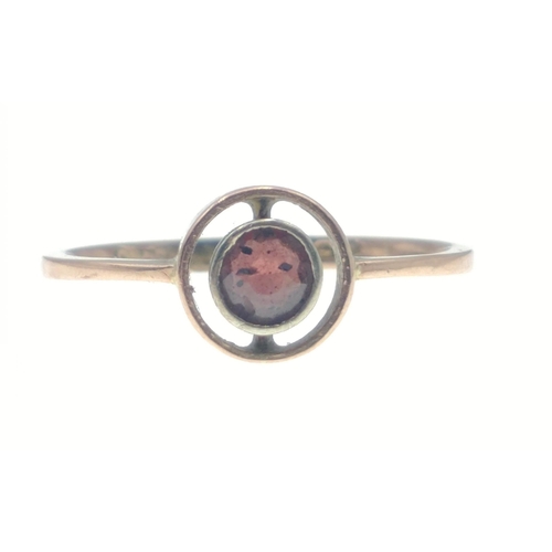 13 - A BIRMINGHAM Hallmarked 375 stamped yellow gold ring with a nice centred garnet within a circular go... 