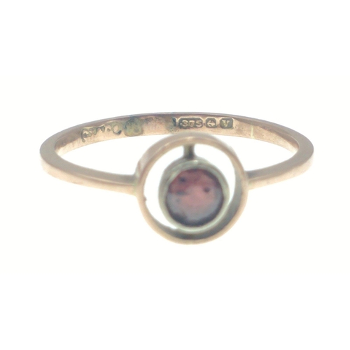 13 - A BIRMINGHAM Hallmarked 375 stamped yellow gold ring with a nice centred garnet within a circular go... 