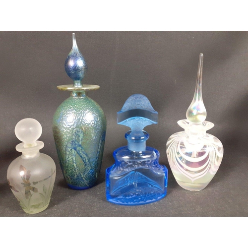 143 - A collection of three fragile Middle Eastern glass perfume bottles, the tallest being 17cm high appr... 