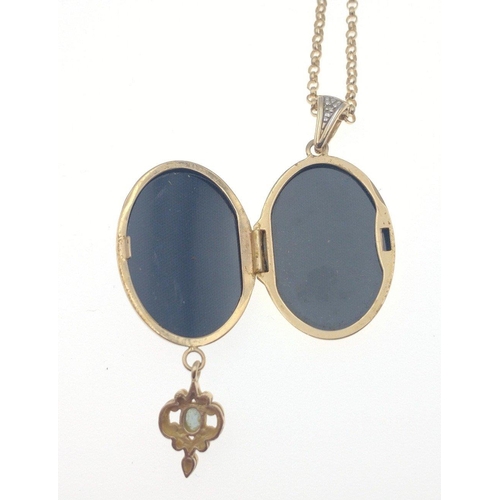 17 - A stamped 375 yellow gold locket with blue stone on a 375 stamped yellow gold chain weight 8.55g gro... 