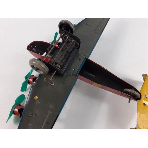 228G - A superb rare 1930s original American tinplate biplane with clockwork motor in working order. Made b... 