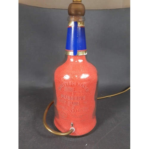 304 - AN INTERESTING vintage 'British Navy Pusser's Rum' bottle converted into a lamp, complete with red p... 