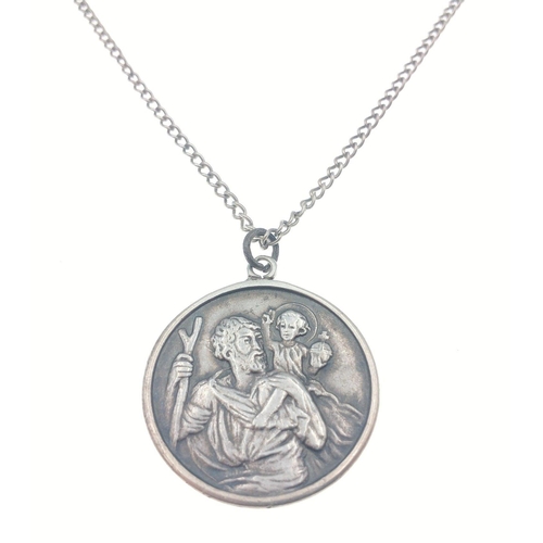 35 - A large silver stamped St Christopher pendant (3cm dia)  on a white metal chain, gross weight 18.90 ... 