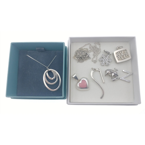 40 - A white metal pendant (3cm long) with 46cm long chain plus a selection of silver charms (gross weigh... 