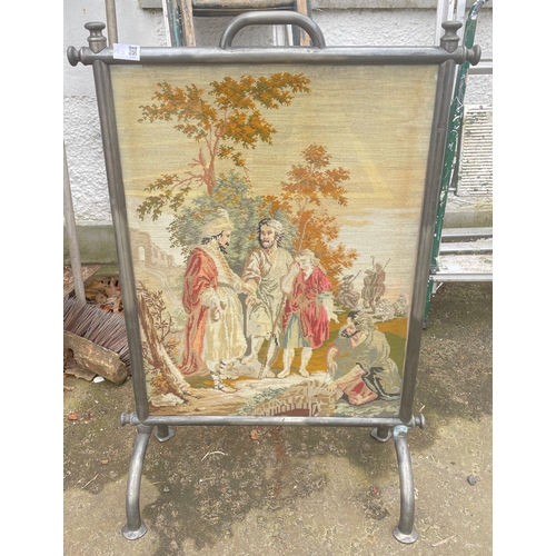 426 - A substantial EDWARDIAN metal-work firescreen with a tapestried classical scene - dimensions 92cm x ... 