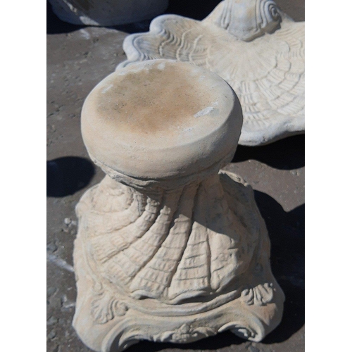 448 - A shell bird bath - a large shell on a decorative base, Dimensions - 49.5cm wide, 41cm tall, approx.... 