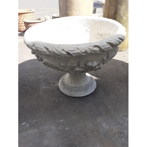 460 - An large urn decorated with acanthus leaves - comes in two pieces. Dimensions- 55cm wide, 40cm tall.... 