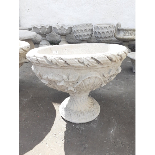 461 - An large urn decorated with acanthus leaves - comes in two pieces. Dimensions- 54cm wide, 44cm tall.... 