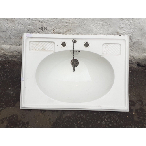 494 - A BARN FIND - an early 20th century moulded ceramic bathroom sink 67Wx48Dx23H cm with original sink ... 