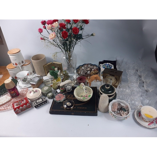 496 - Two boxes of assorted glassware and household objects which includes 14 crystal glasses, place mat s... 