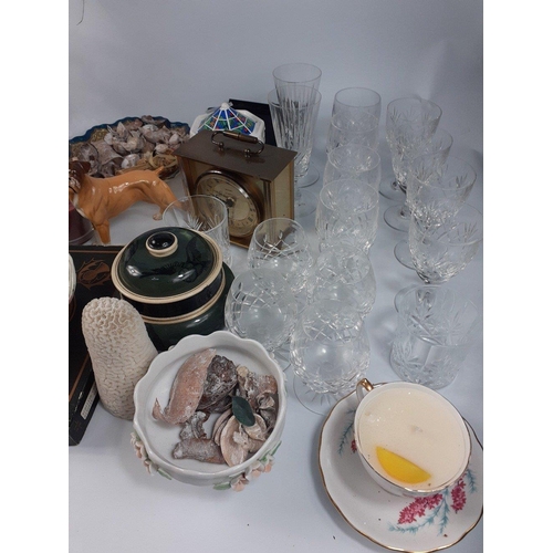 496 - Two boxes of assorted glassware and household objects which includes 14 crystal glasses, place mat s... 