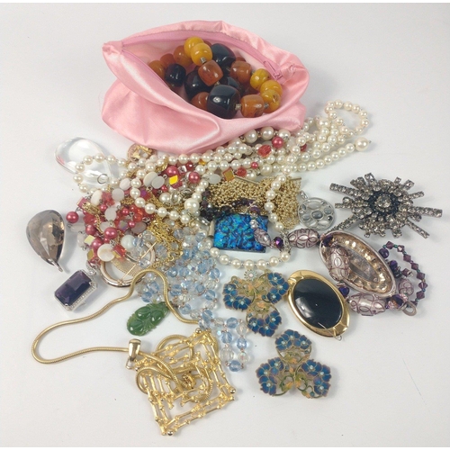 54 - A bag full of costume jewellery to include faux pearls#57