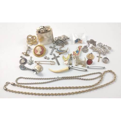 57 - A bag of unmarked mixed jewellery to include brooches, chains, white metal cross pendants, a white m... 