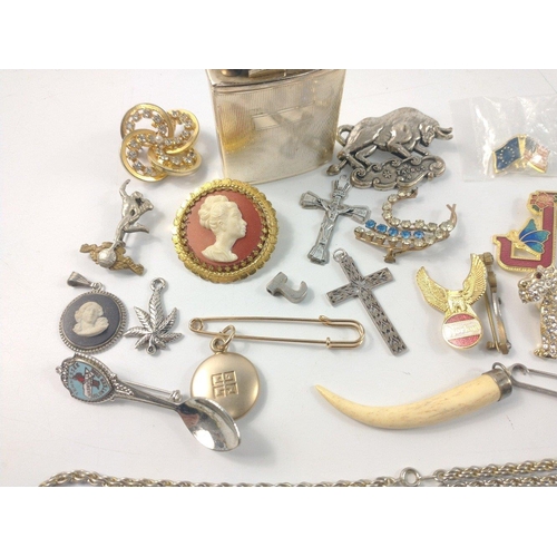 57 - A bag of unmarked mixed jewellery to include brooches, chains, white metal cross pendants, a white m... 