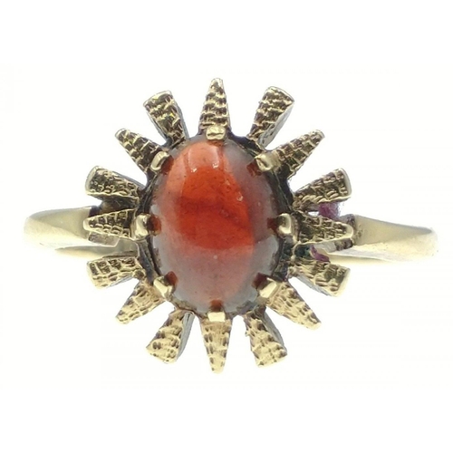 6 - A 375 stamped yellow gold ring with red stone, Size N/O, gross weight 3.75g#7