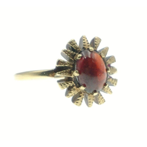 6 - A 375 stamped yellow gold ring with red stone, Size N/O, gross weight 3.75g#7