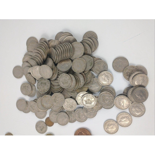 78 - A large collection of UK coins to include a bag of post WWll George Vl one shilling coins, a small b... 