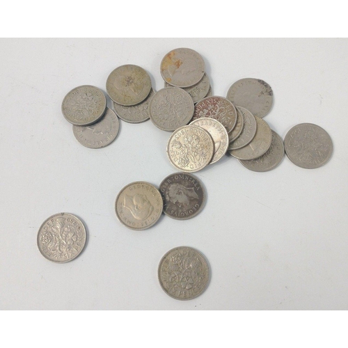 78 - A large collection of UK coins to include a bag of post WWll George Vl one shilling coins, a small b... 