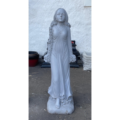 469 - A heavy stone effect ‘GORGEOUS GIRL' in an evening gown garden statue / standing 80cm tall - i... 