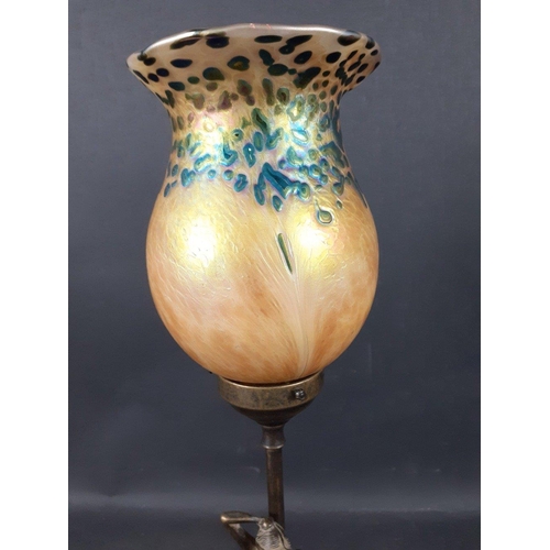 624 - A brass table lamp with a naked lady (21cm tall approx) supporting stem and a HERON GLASS iridescent... 