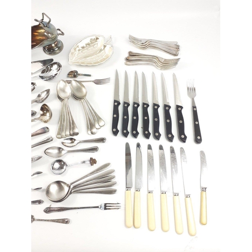 671 - A box lot of large amount of cutlery to include teaspoons, forks, knives, steak knives, a plated sug... 