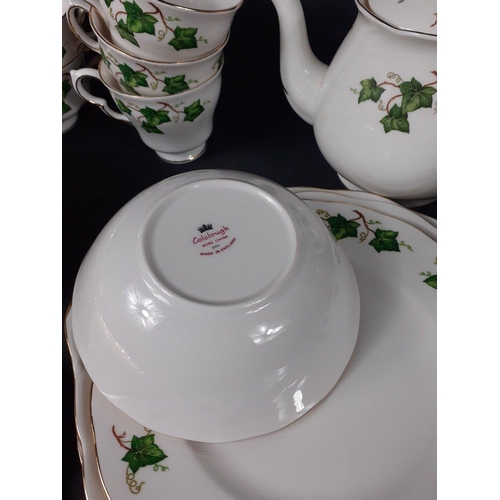 689 - A part service by COLCLOUGH with an ivy pattern to include 5 coffee cups, 3 teacups, 1 teapot, 2 pla... 