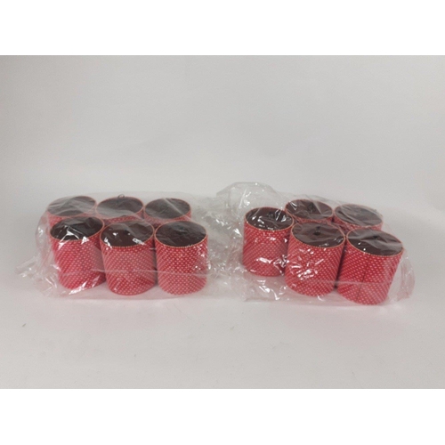 702 - Eleven red wooden storage canisters 9cm tall, 8cm dia#278