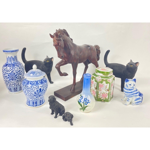 818 - A mixed box of mainly ceramics to include some blue and white cats and a ginger jar, also some canin... 