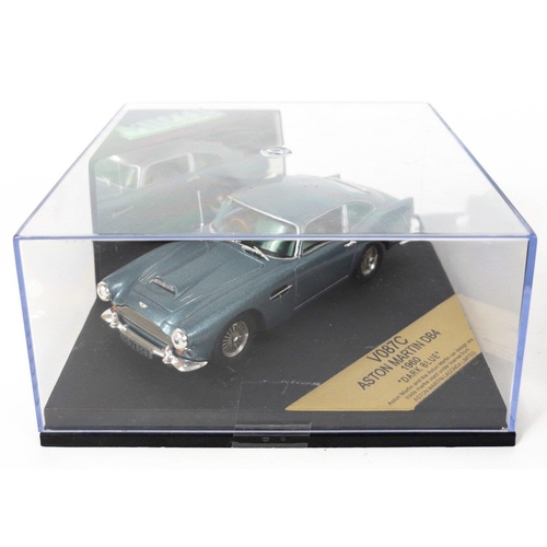 110 - JAMES BOND - Vitesse V087C Aston Martin DB4 1960 dark blue in Perspex case, plus an Aston Martin V12... 